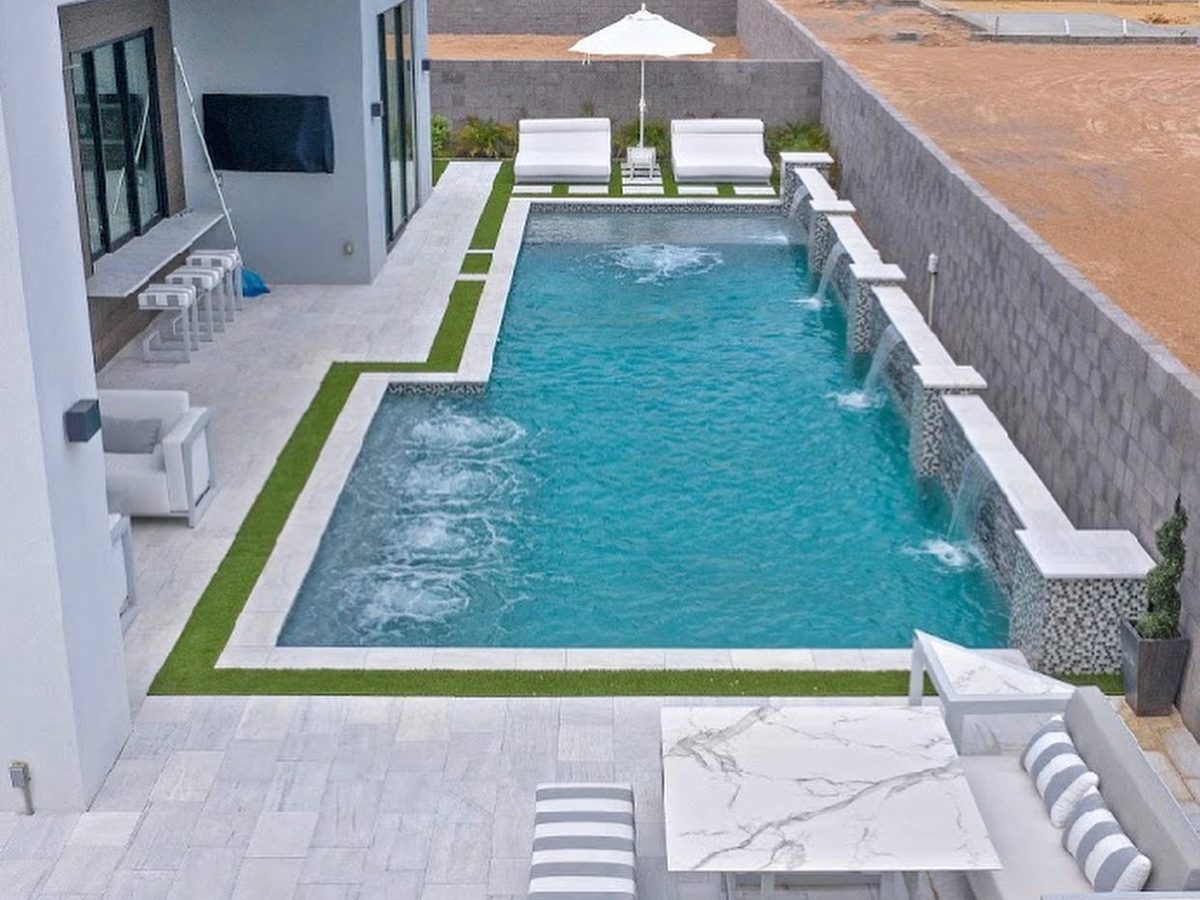 Modern rectangle pool with wall scuppers and shelf bubblers