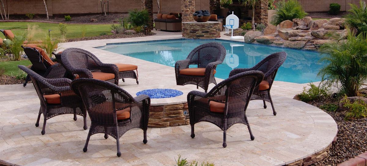 Fire pit seating beside a No Limit pool