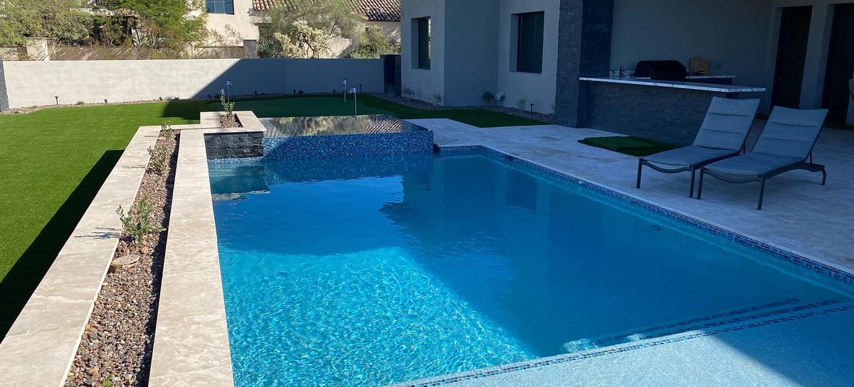 Finished pool and raised spa with loungers, ready for the first swim